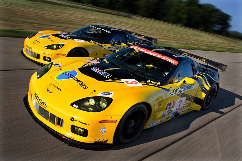 Yellow race cars on a track