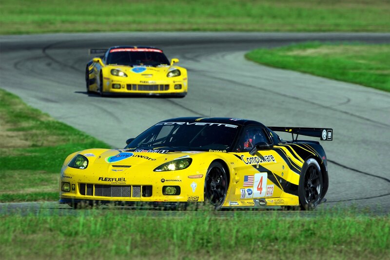 Yellow race cars on a track