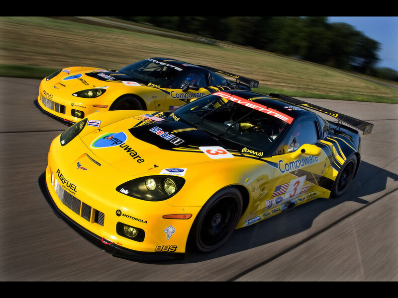 Yellow race cars on a track