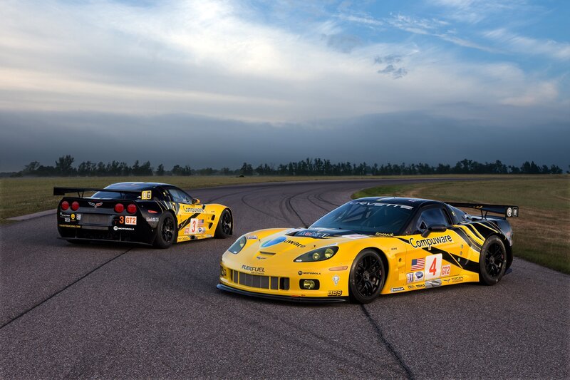 Yellow race cars on a track