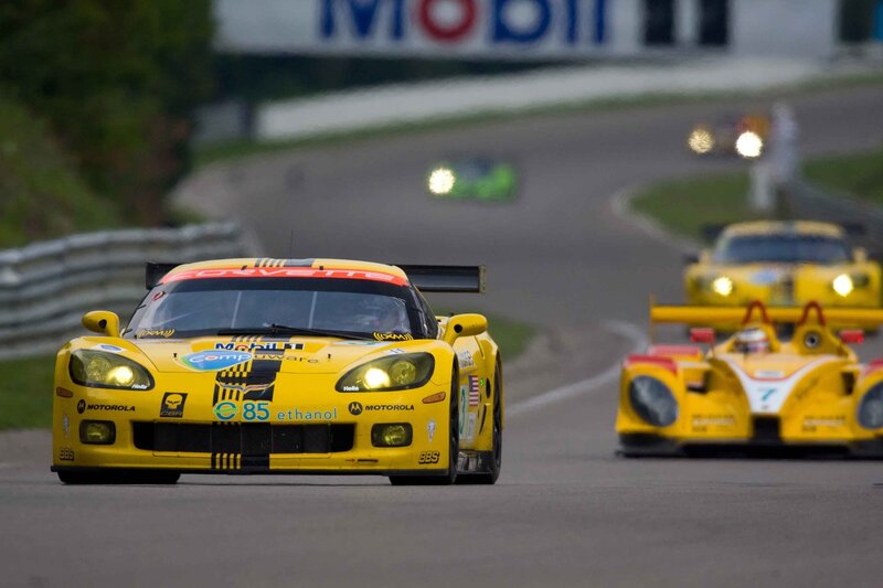 Yellow race cars on track