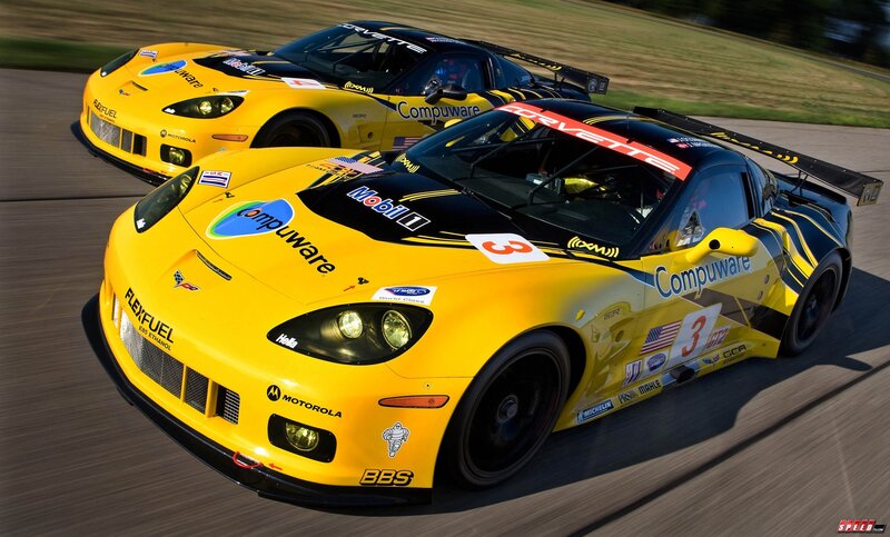 Yellow race cars on track