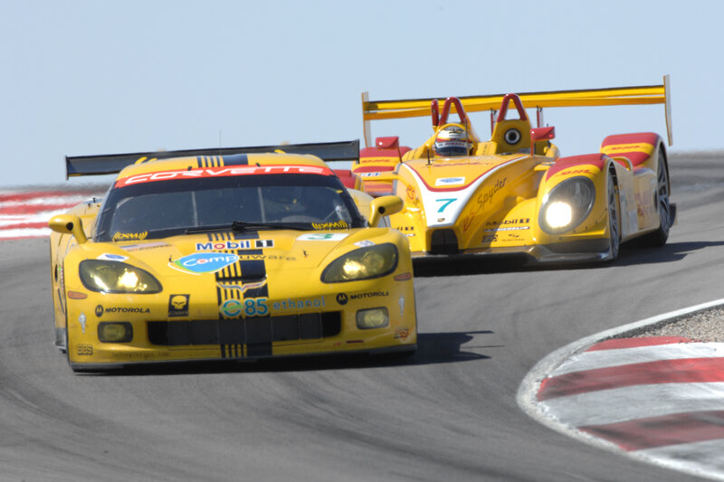 Yellow race cars on track