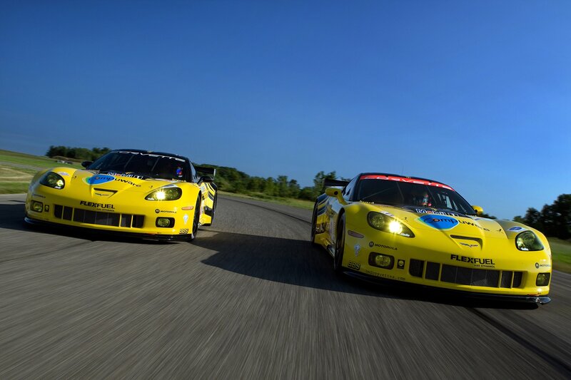 Yellow race cars on track