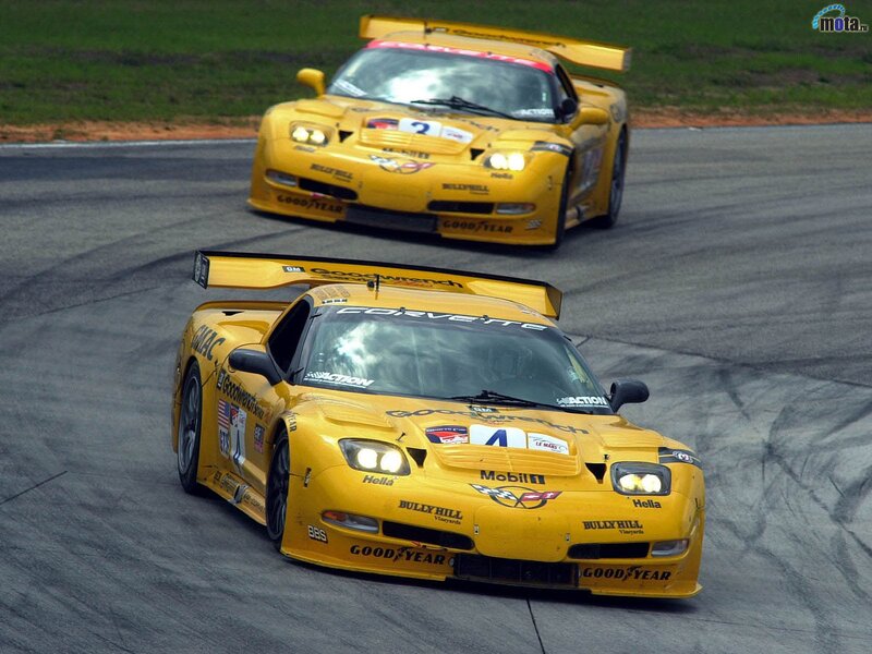 Yellow race cars on track