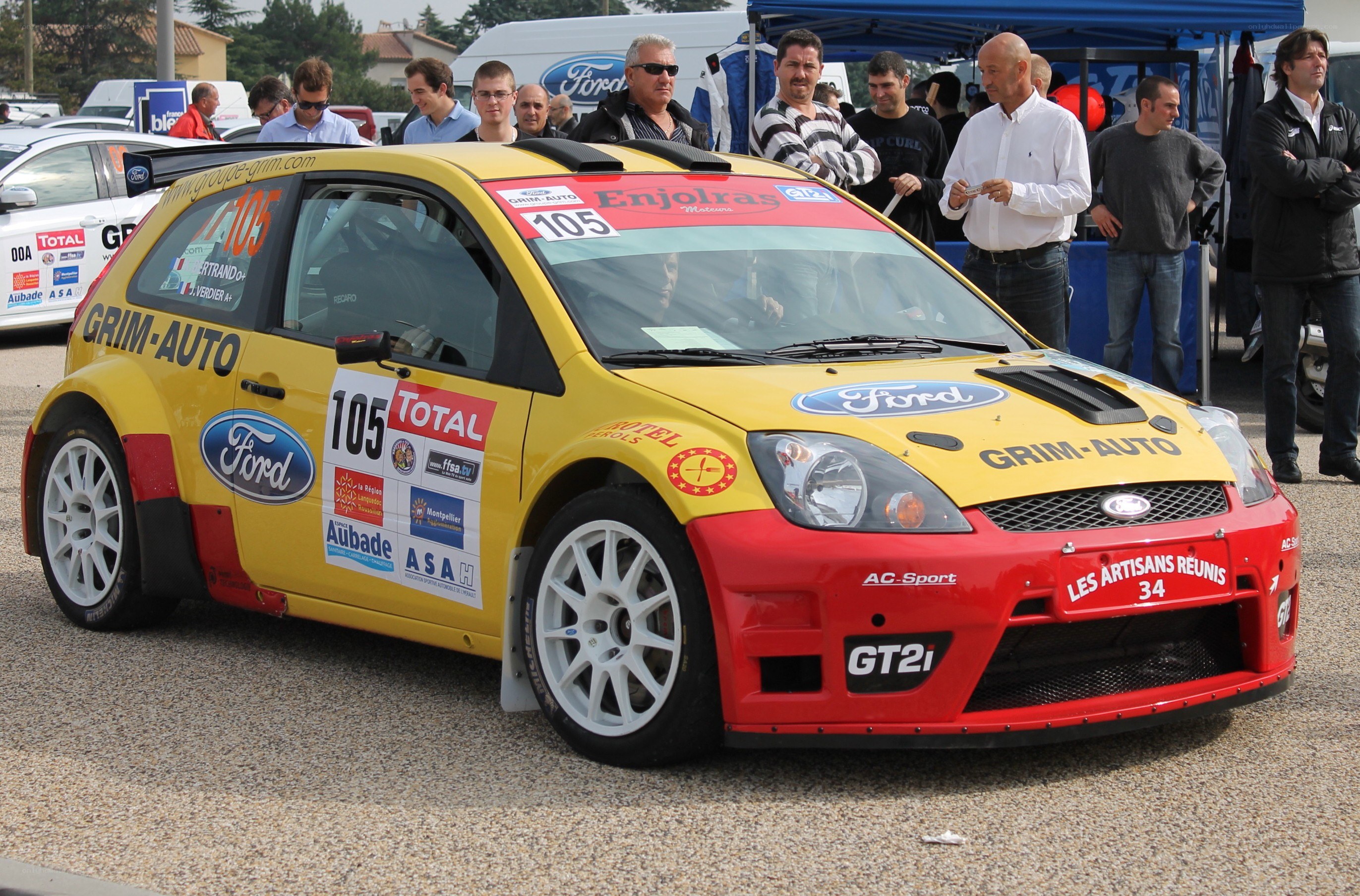 Yellow rally car at event