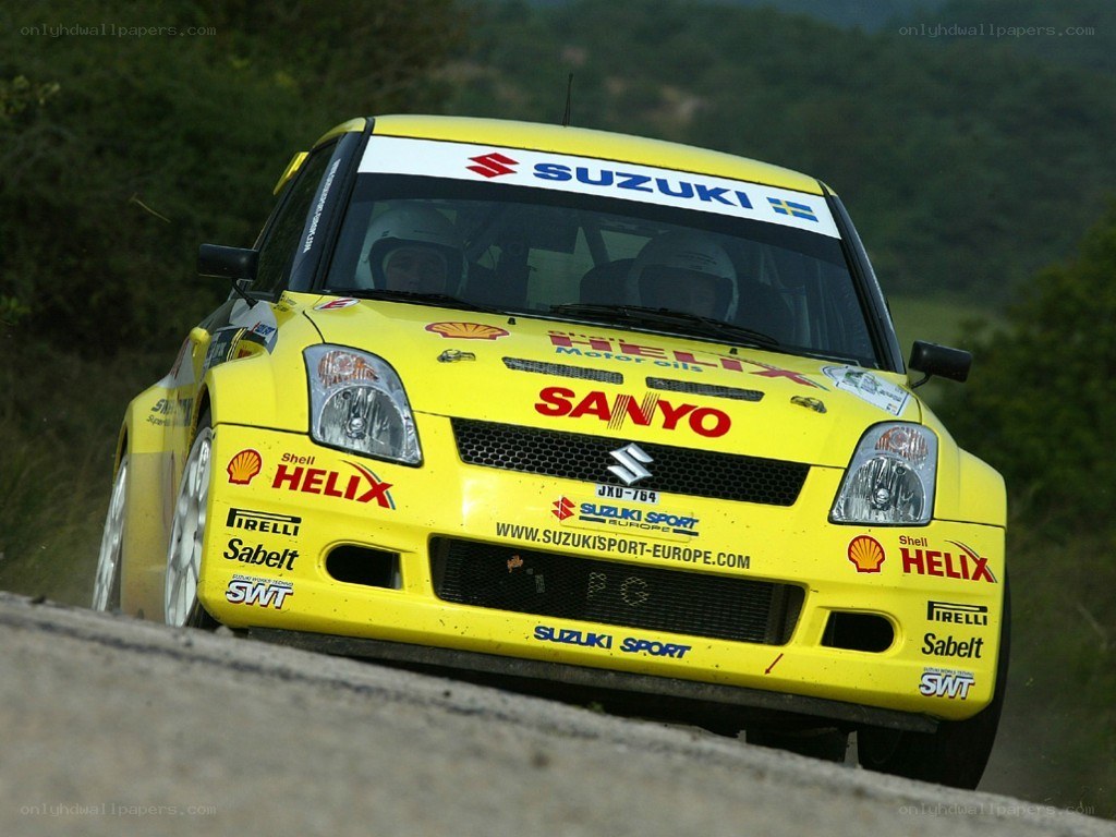 Yellow rally car on a road
