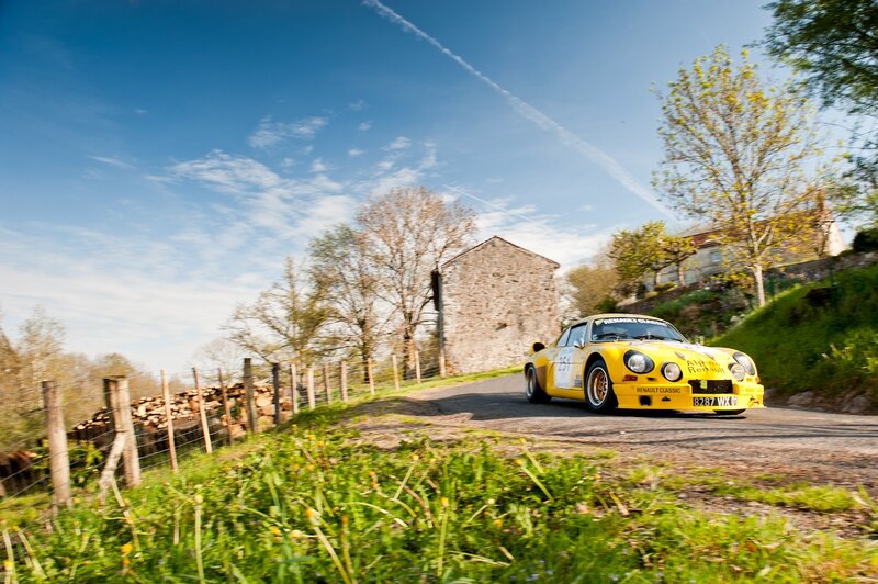 Yellow rally car on country road