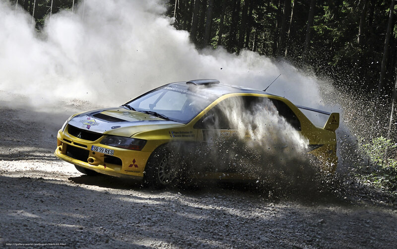 Yellow rally car on dirt road