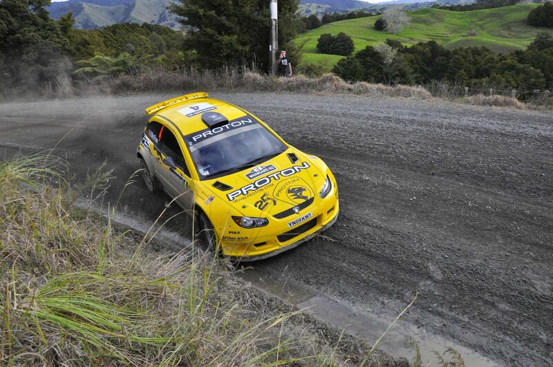 Yellow rally car on dirt road
