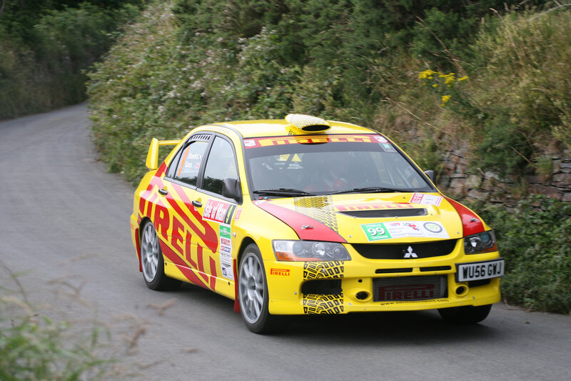 Yellow rally car on road