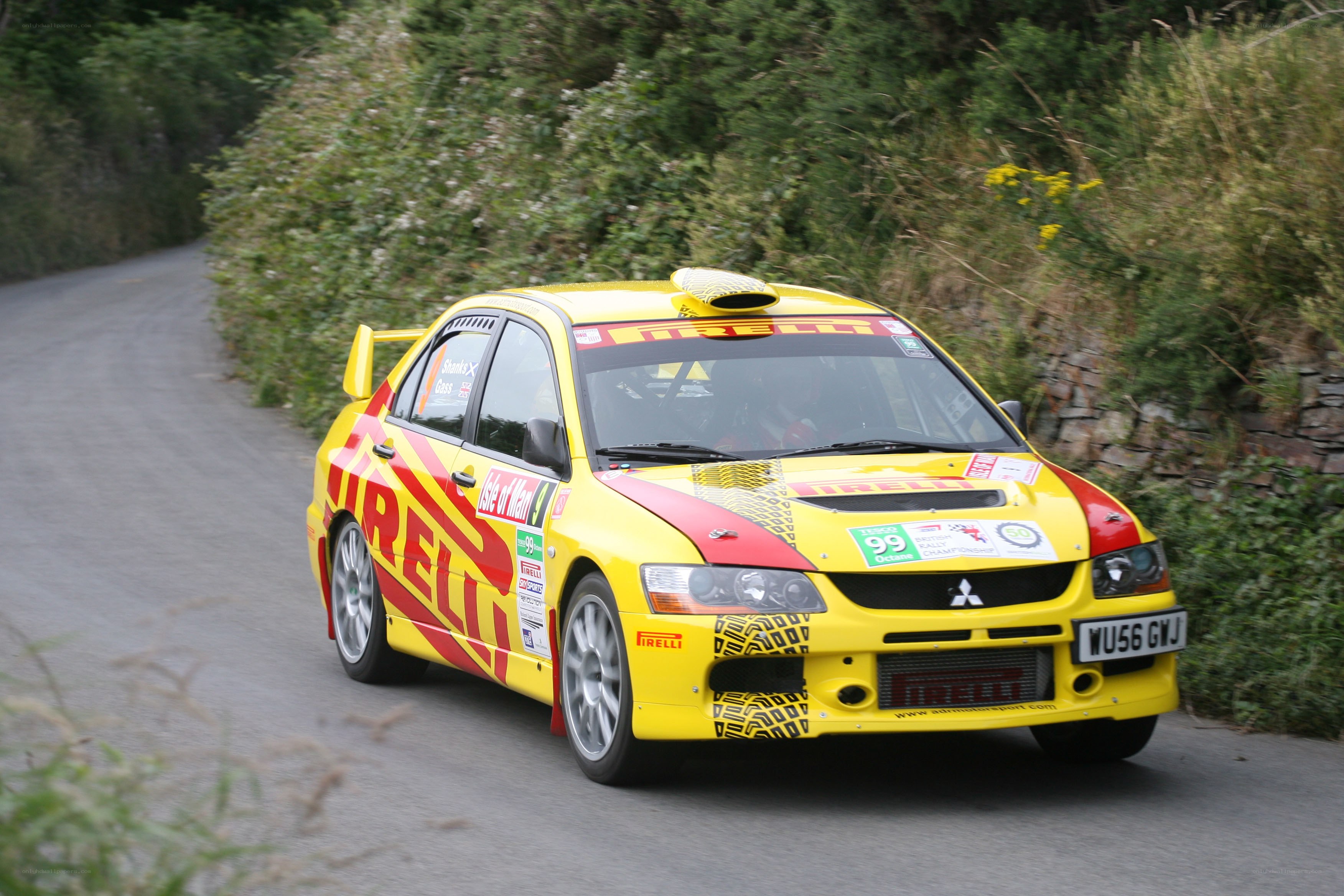 Yellow rally car on road