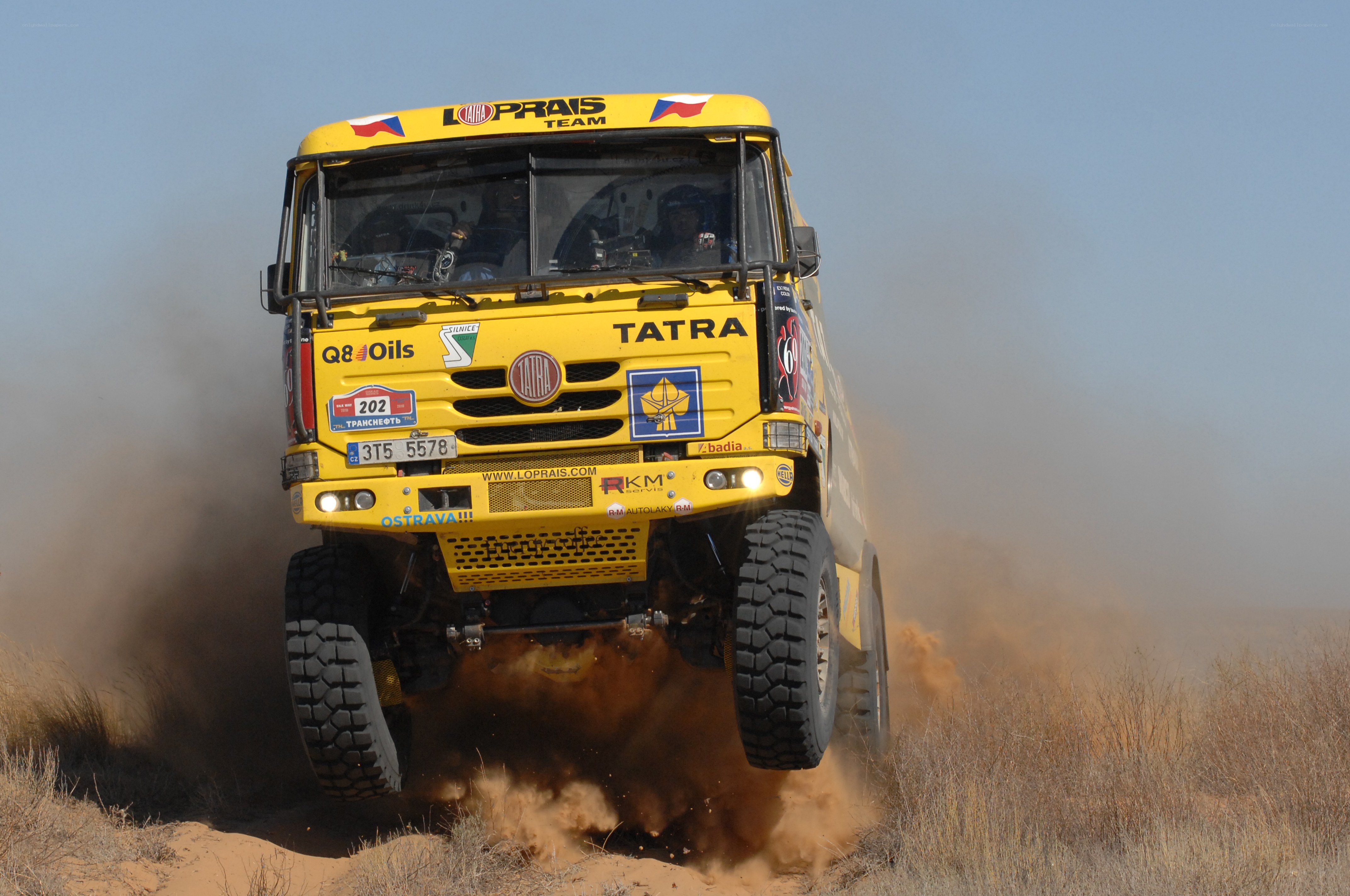 Yellow rally truck in action