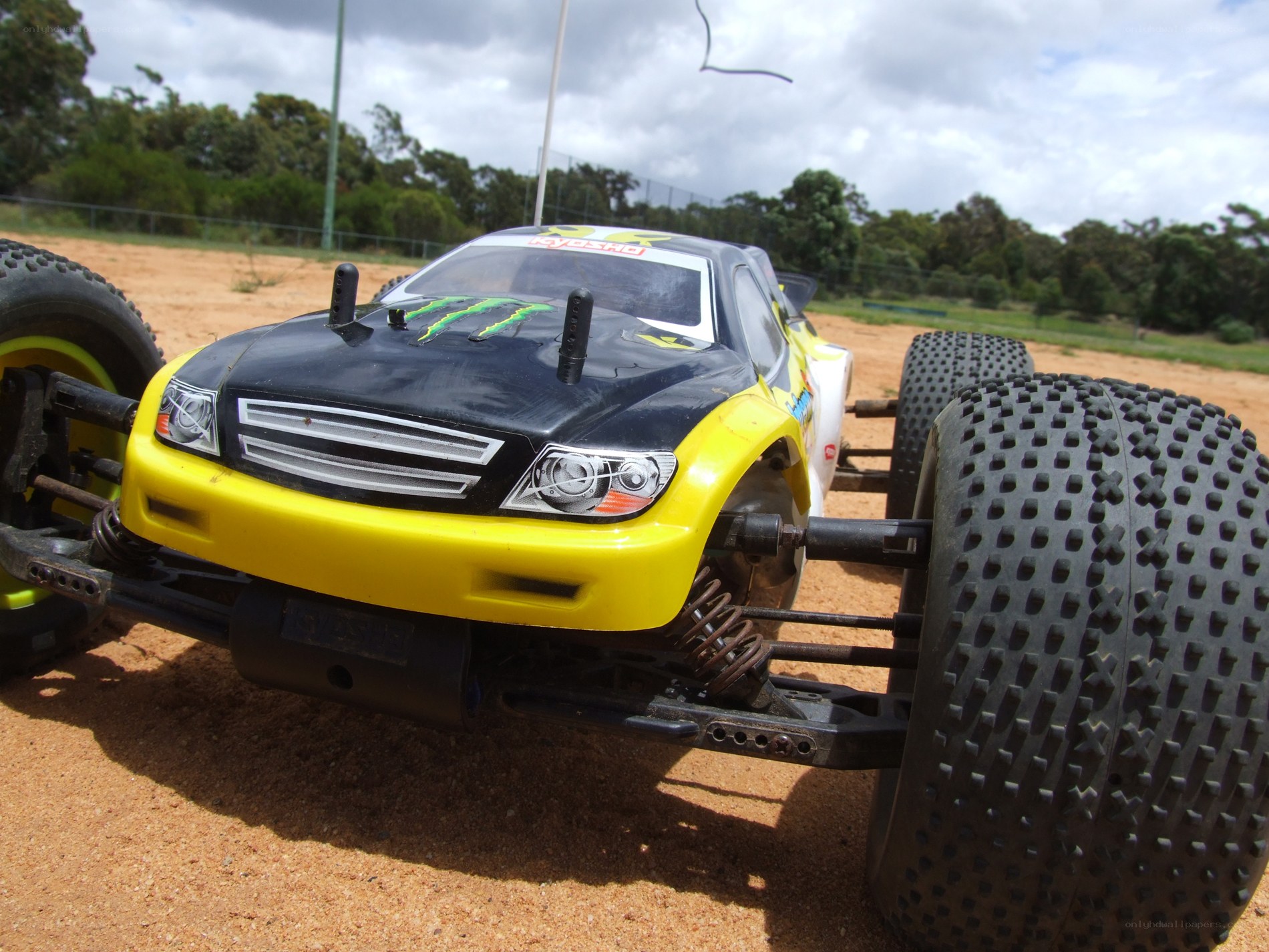 yellow rc car on dirt