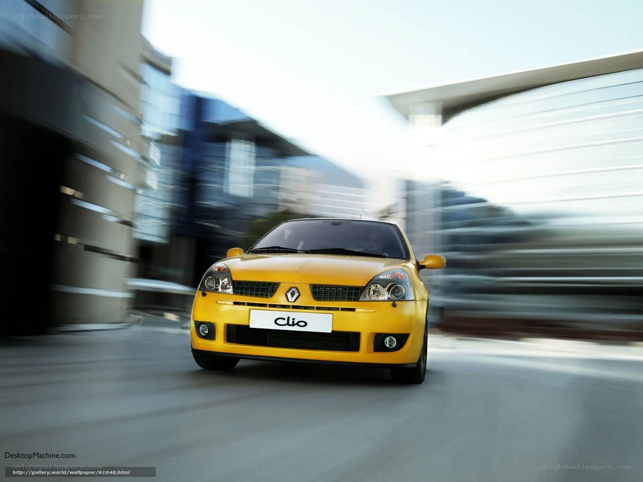 Yellow Renault Clio in motion