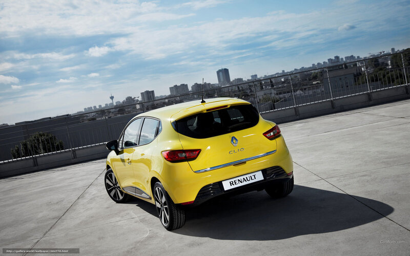 Yellow Renault Clio on rooftop
