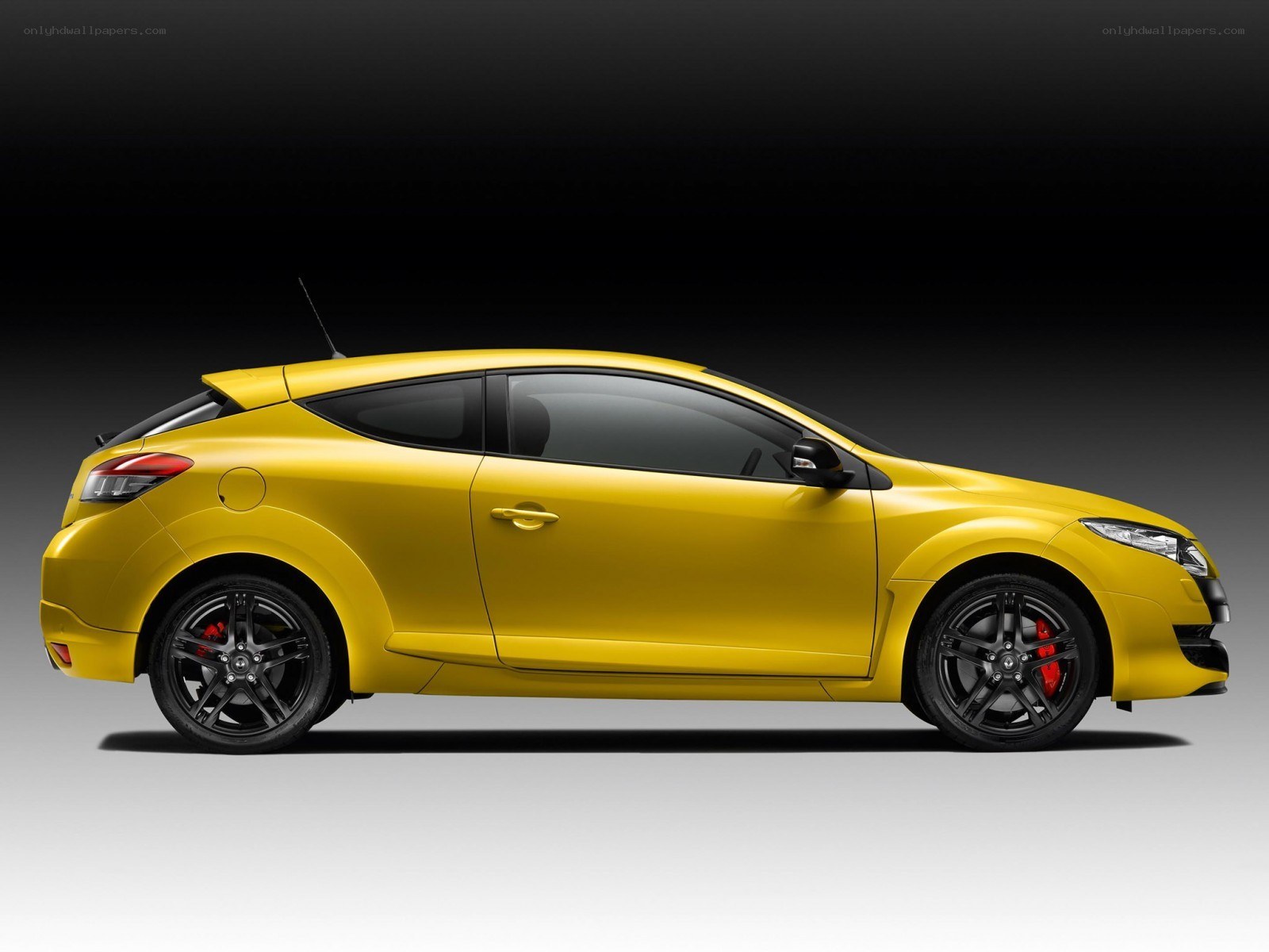 yellow renault megane coupe
