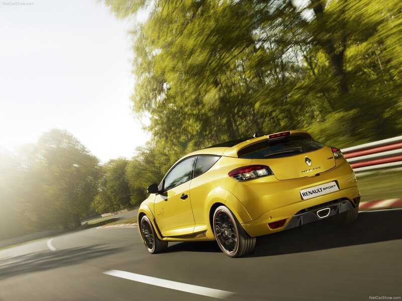 yellow renault megane in motion