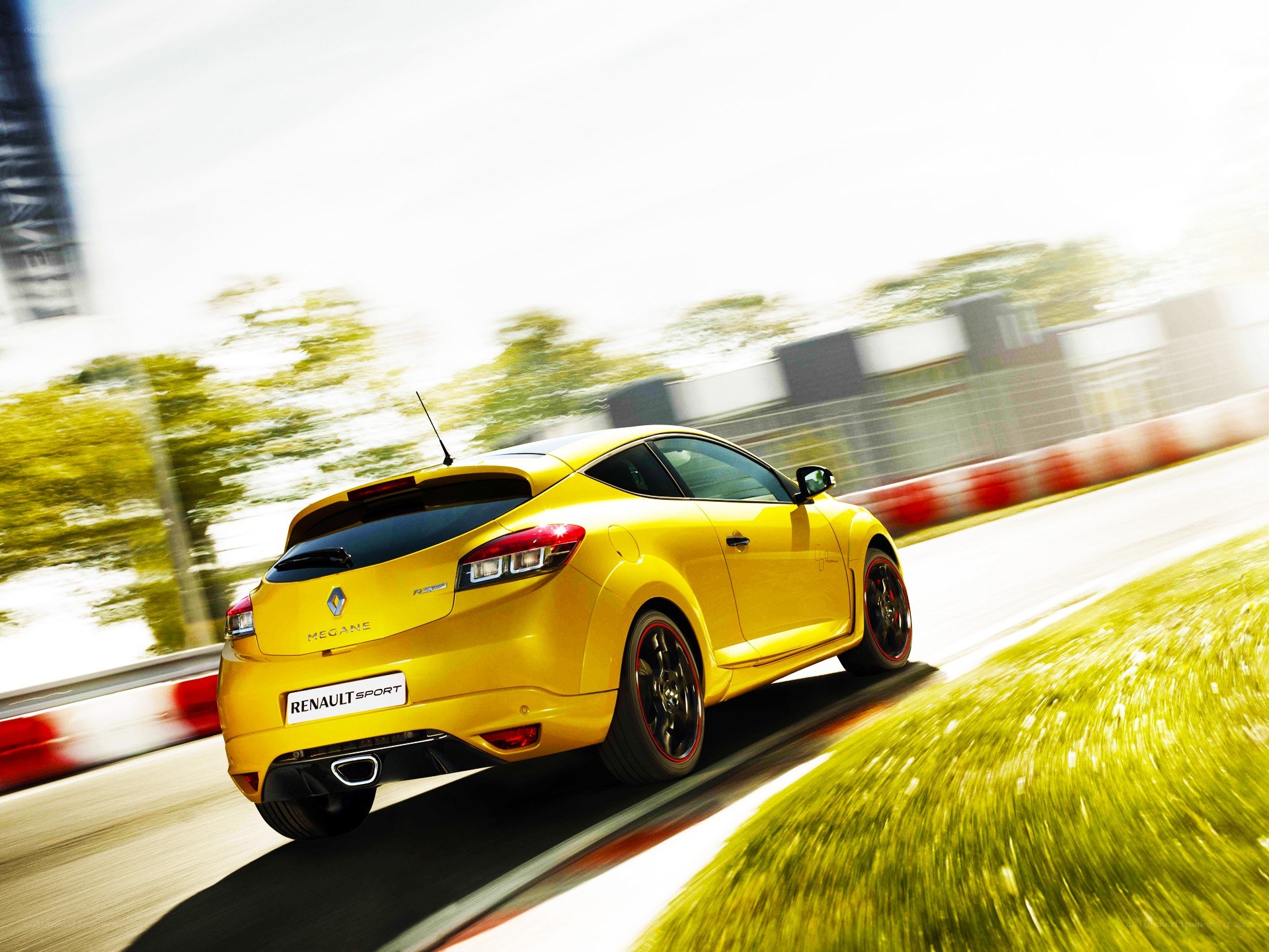 Yellow Renault Megane in motion