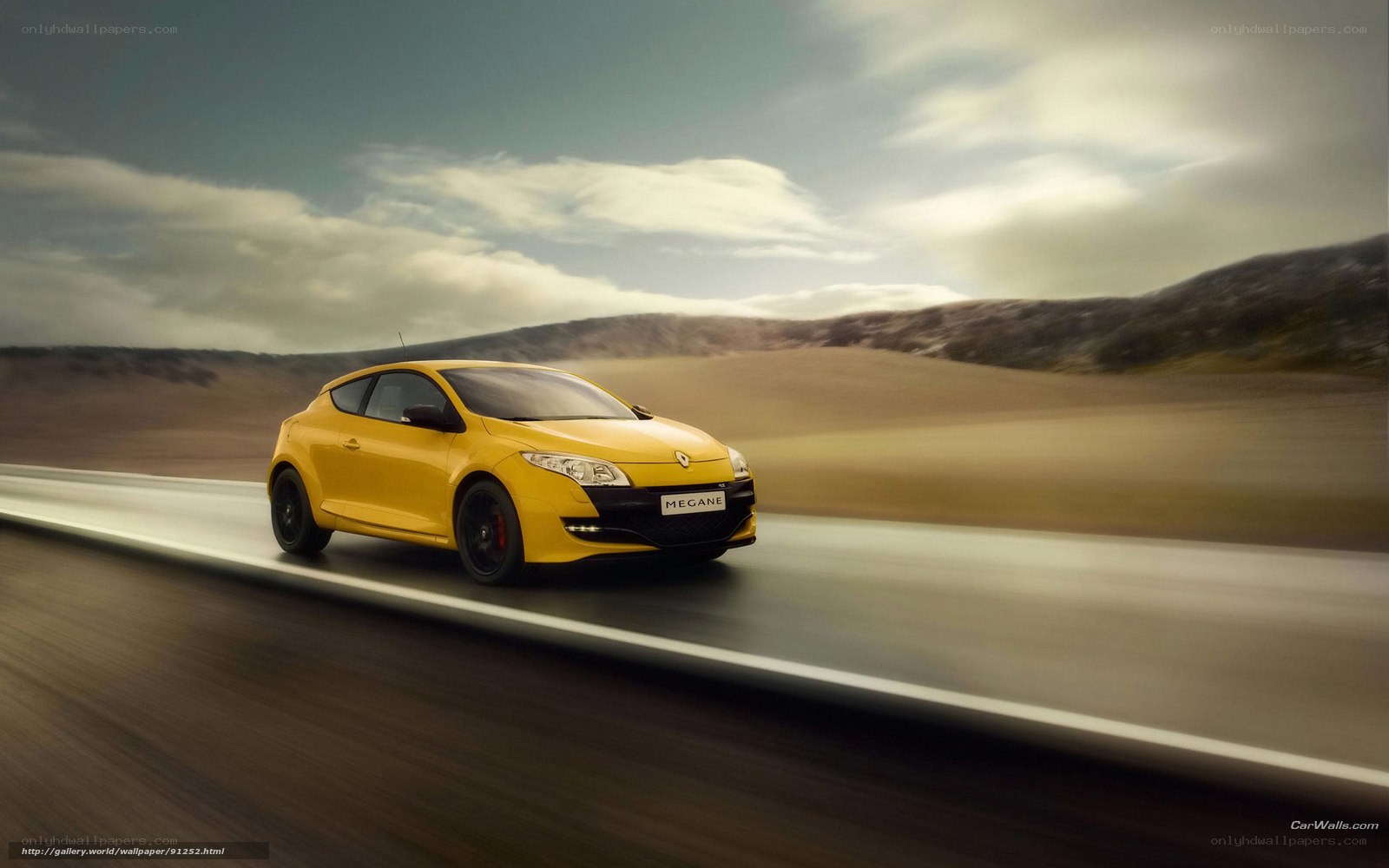Yellow Renault Megane in motion