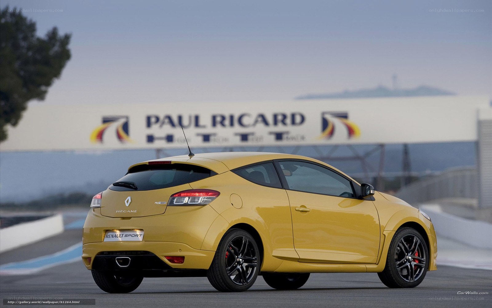 yellow renault megane on racetrack