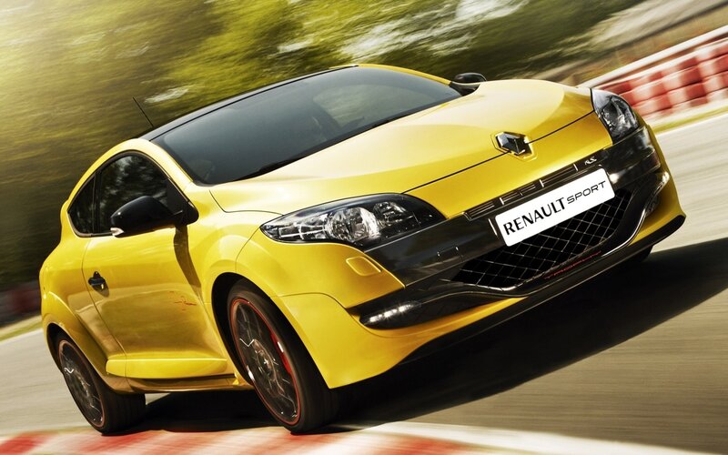 Yellow Renault Sport car in motion