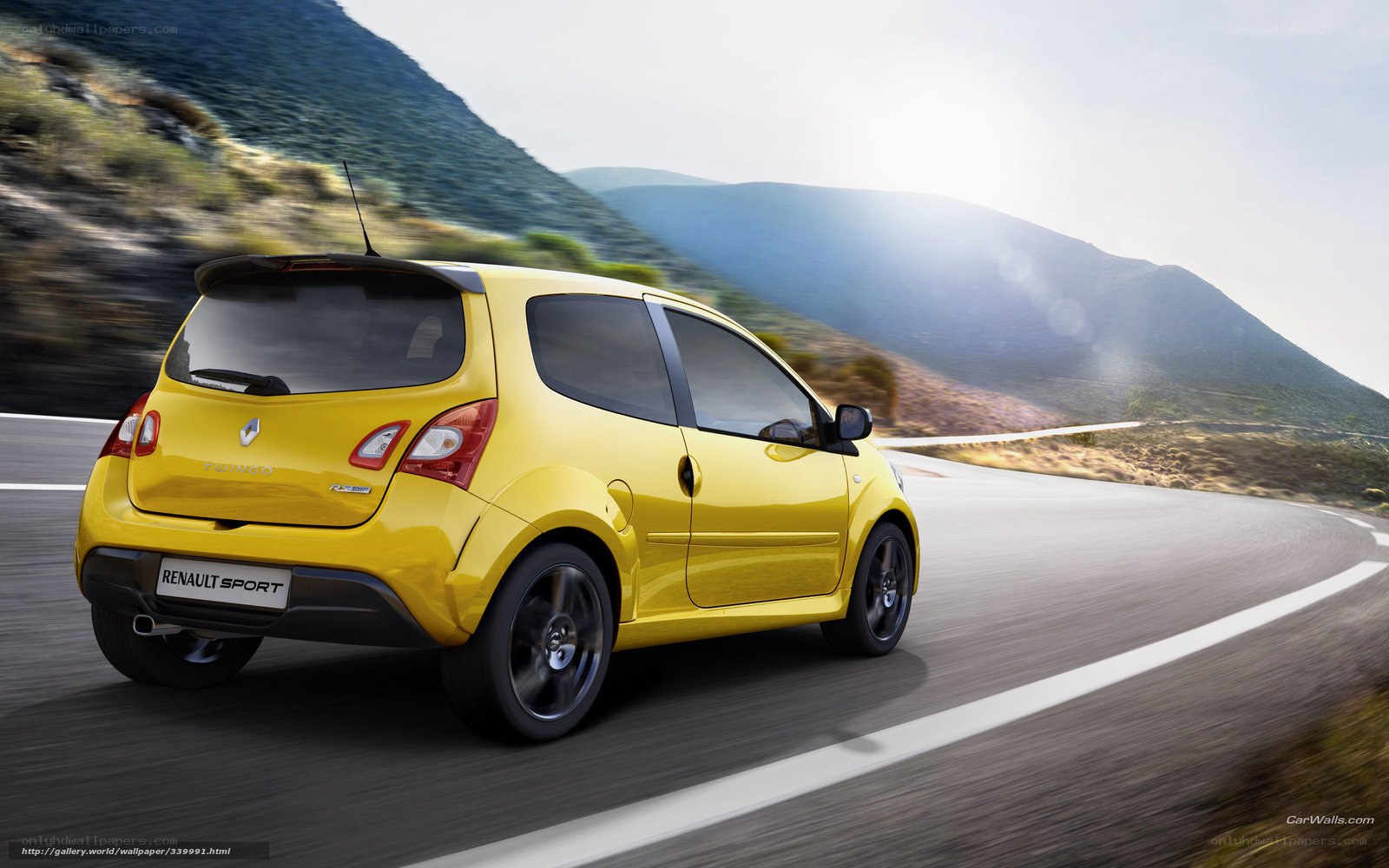 Yellow Renault Twingo on a mountain road