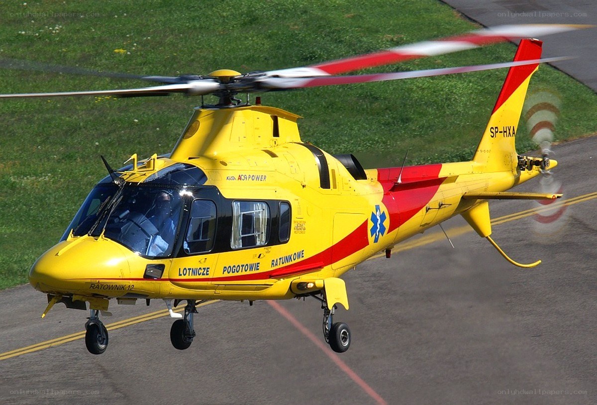 Yellow rescue helicopter in flight