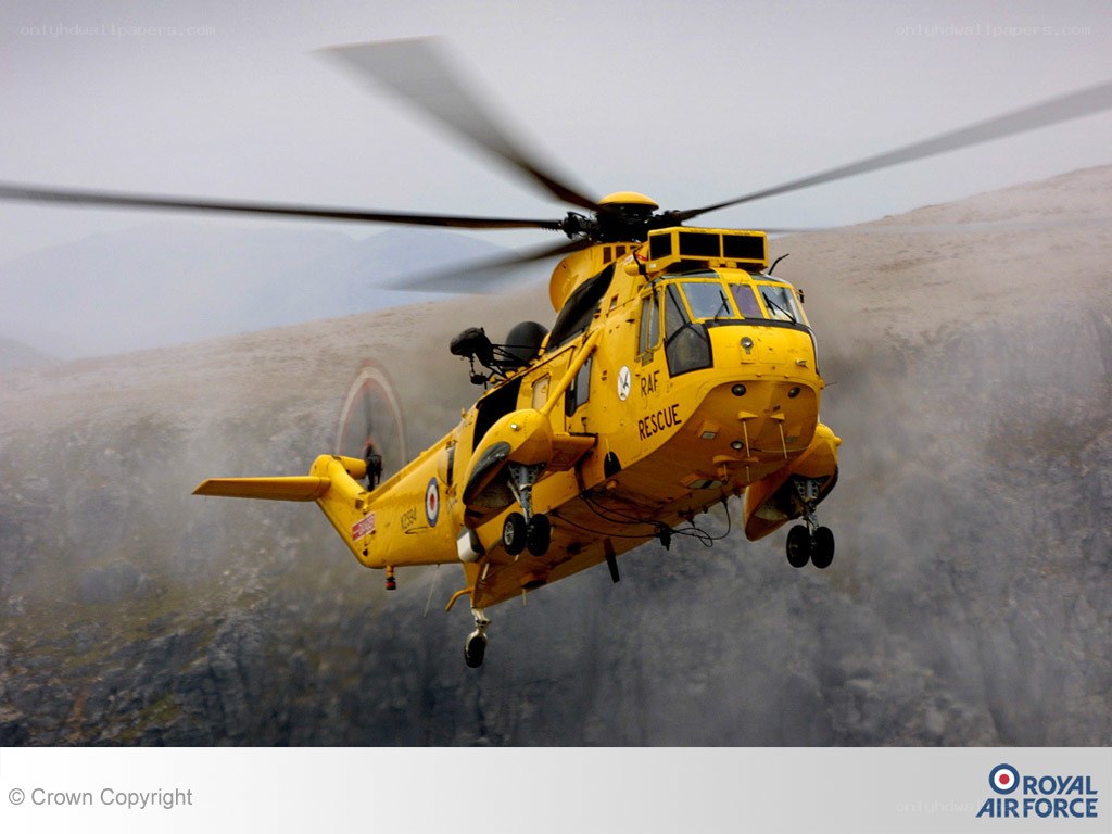 Yellow rescue helicopter in flight