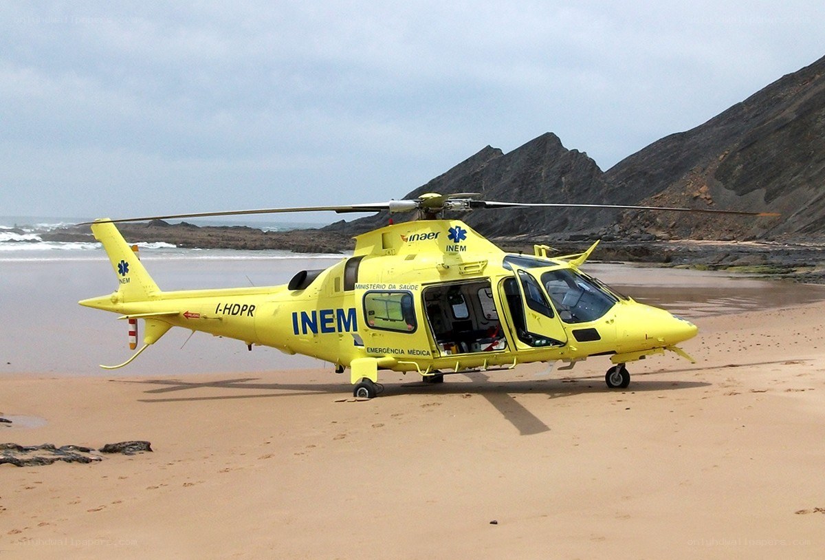 Yellow rescue helicopter on beach