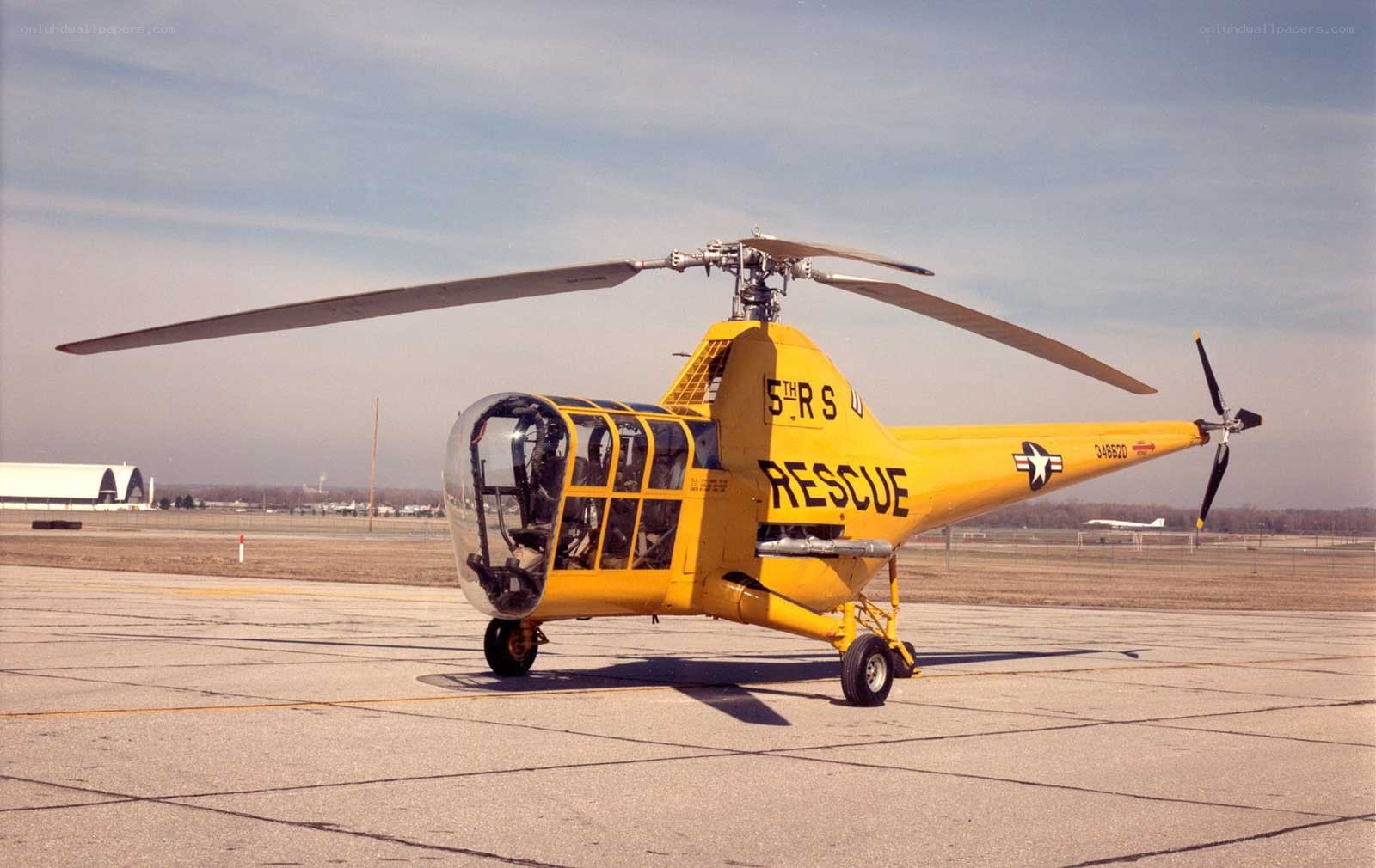 Yellow rescue helicopter on tarmac