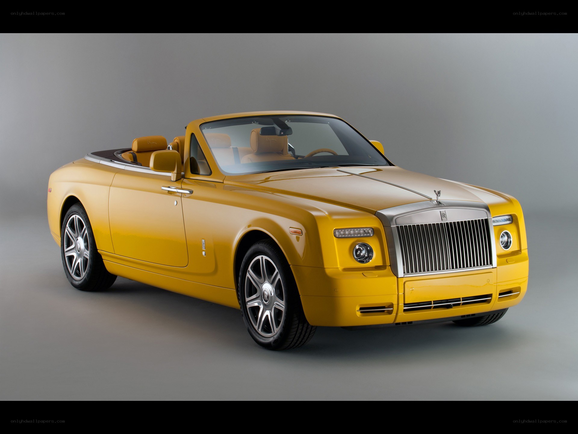 yellow rolls-royce convertible