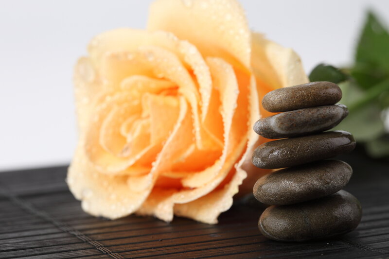 Yellow Rose and Stacked Stones