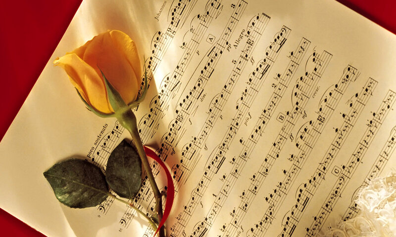 Yellow Rose on Sheet Music — Romantic