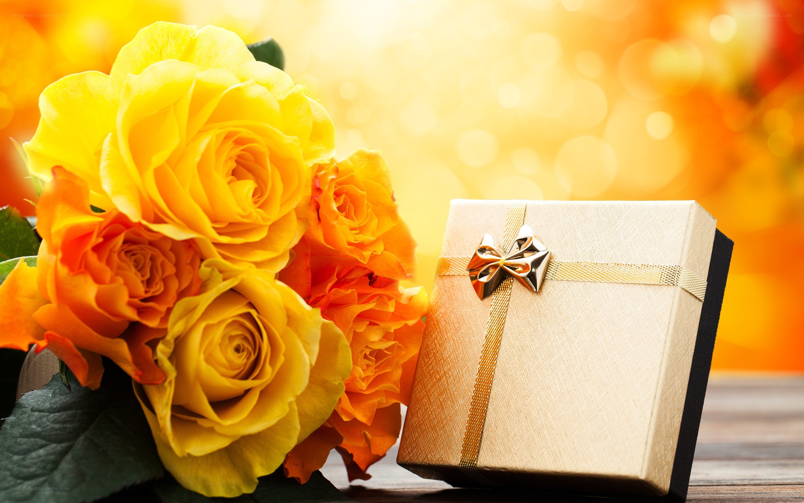 Yellow roses and gift box