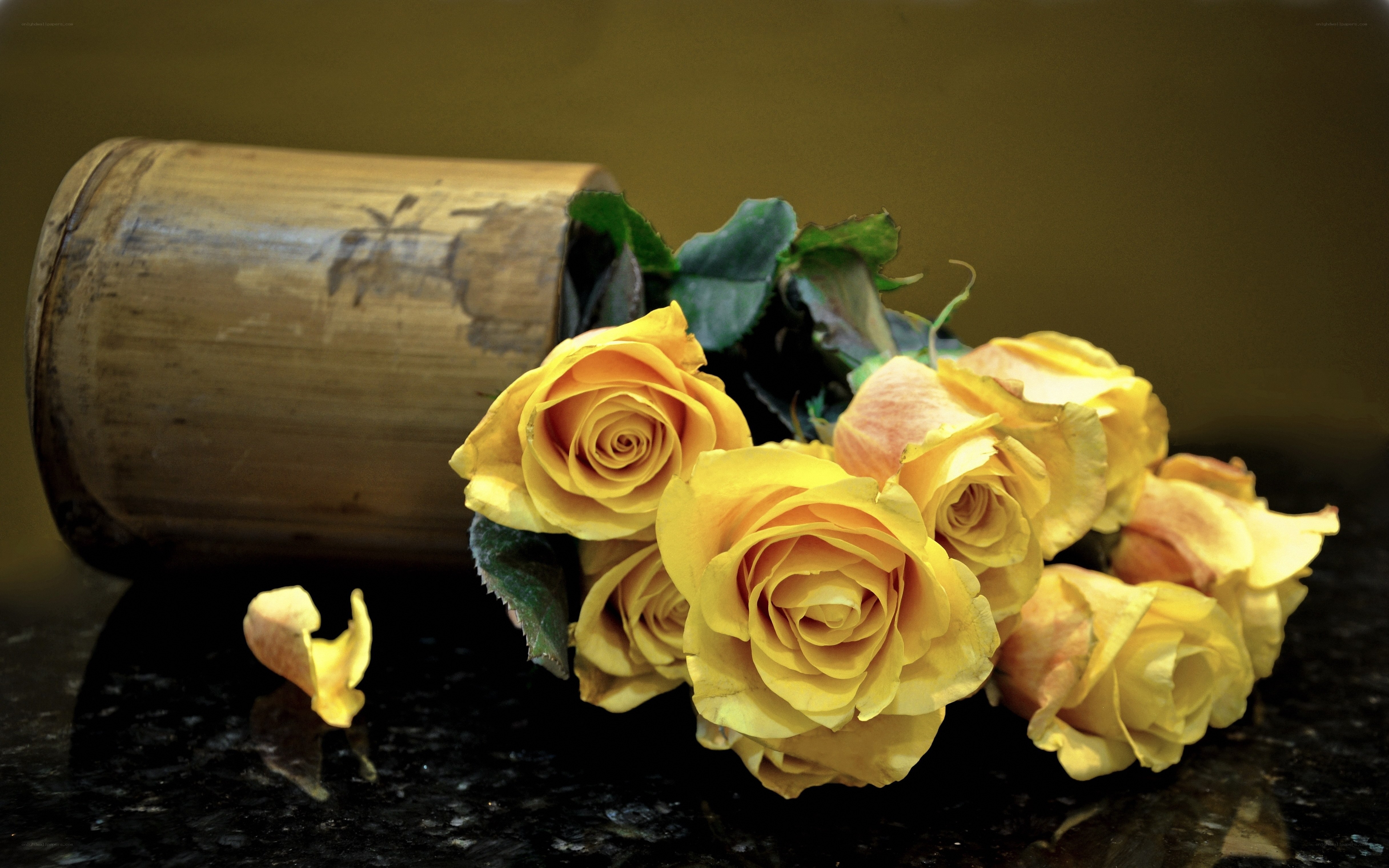 Yellow roses in bamboo vase