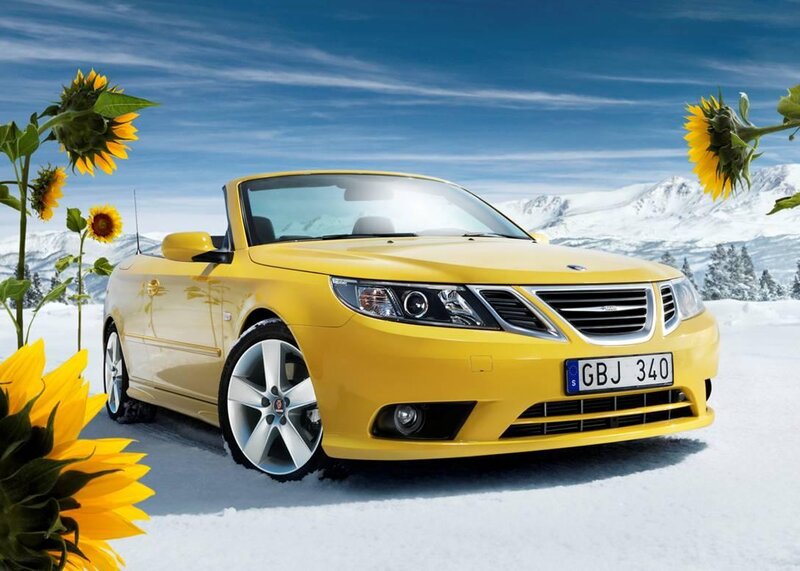 Yellow Saab in Snowy Landscape