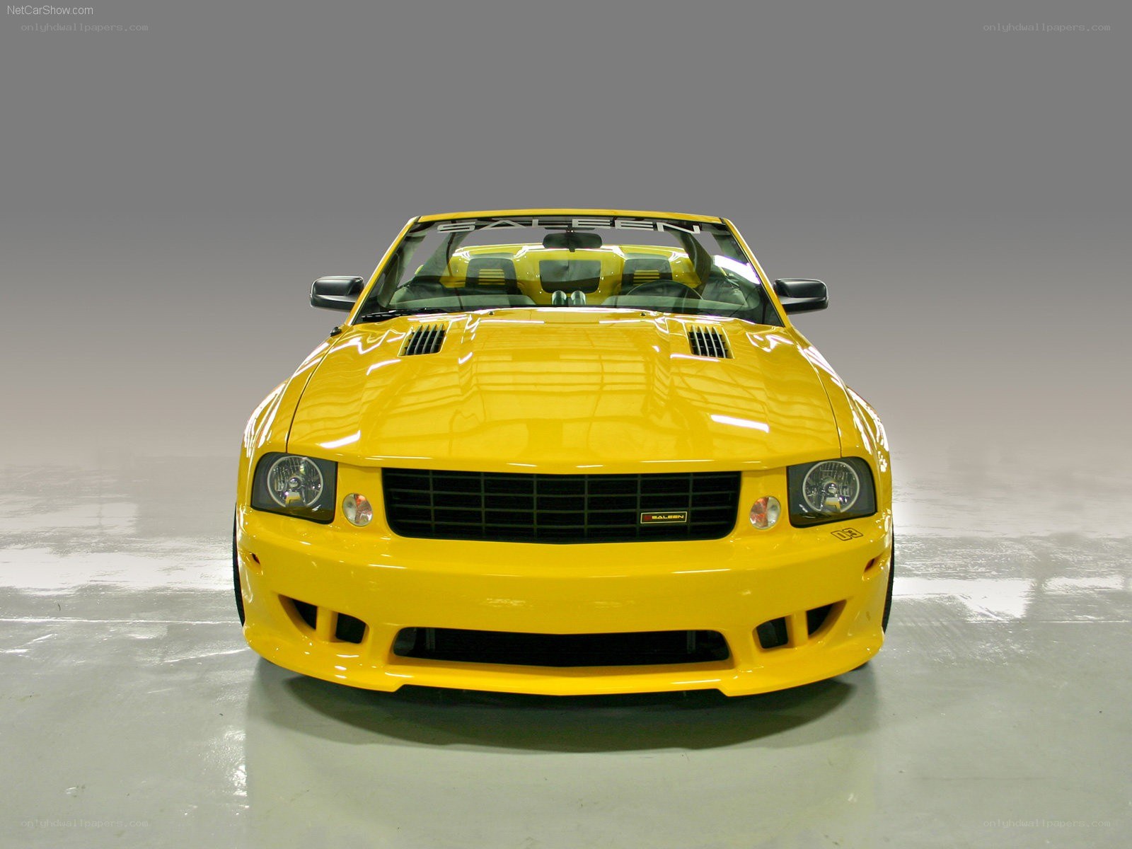 yellow saloon convertible car