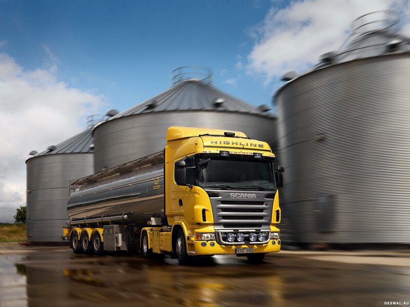 Yellow Scania truck at grain silos