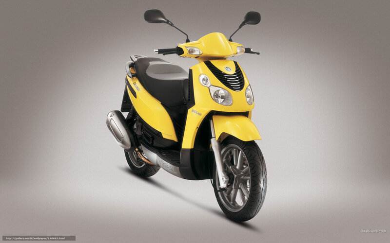 Yellow scooter on gray background