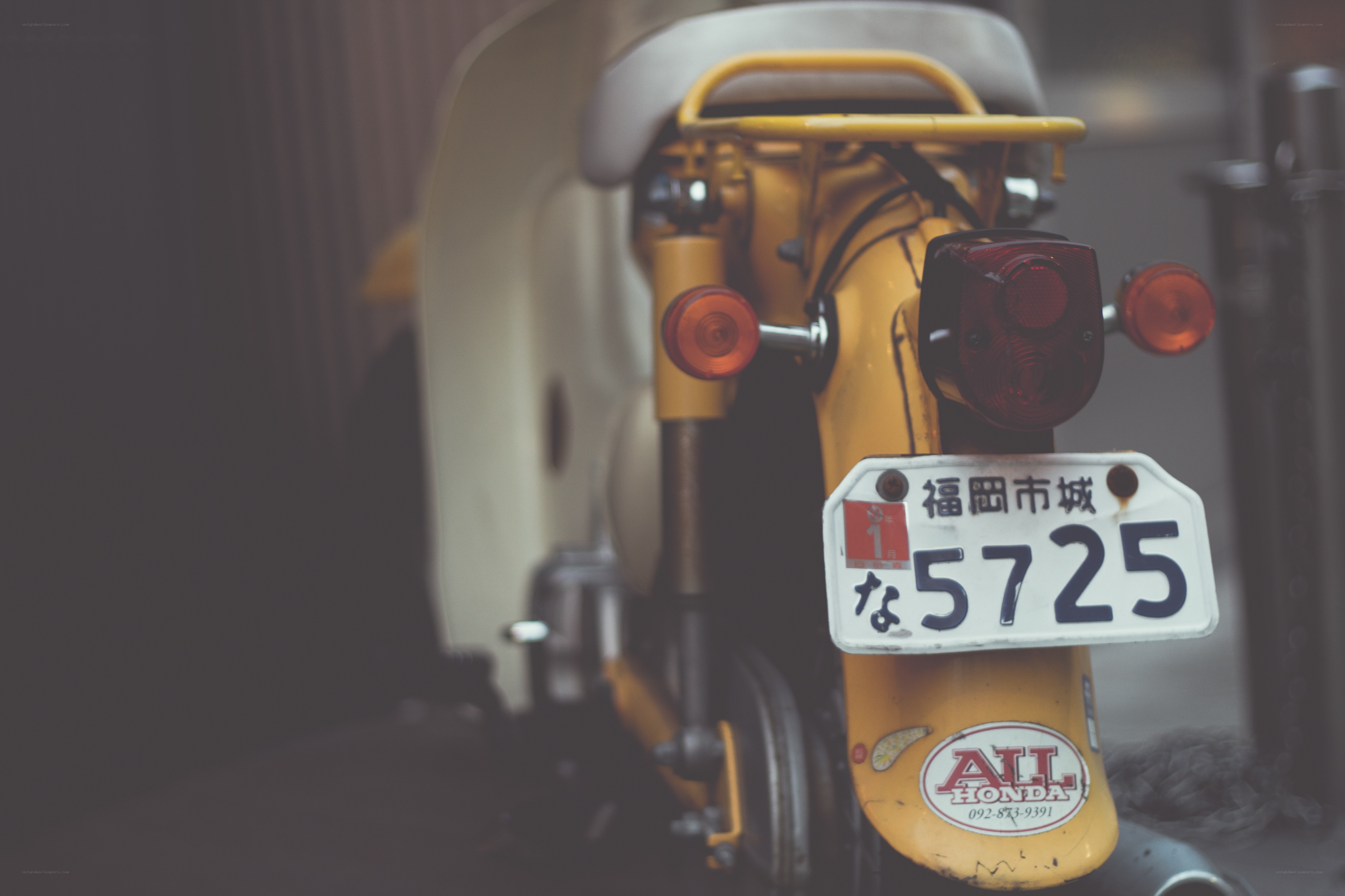 Yellow scooter rear view