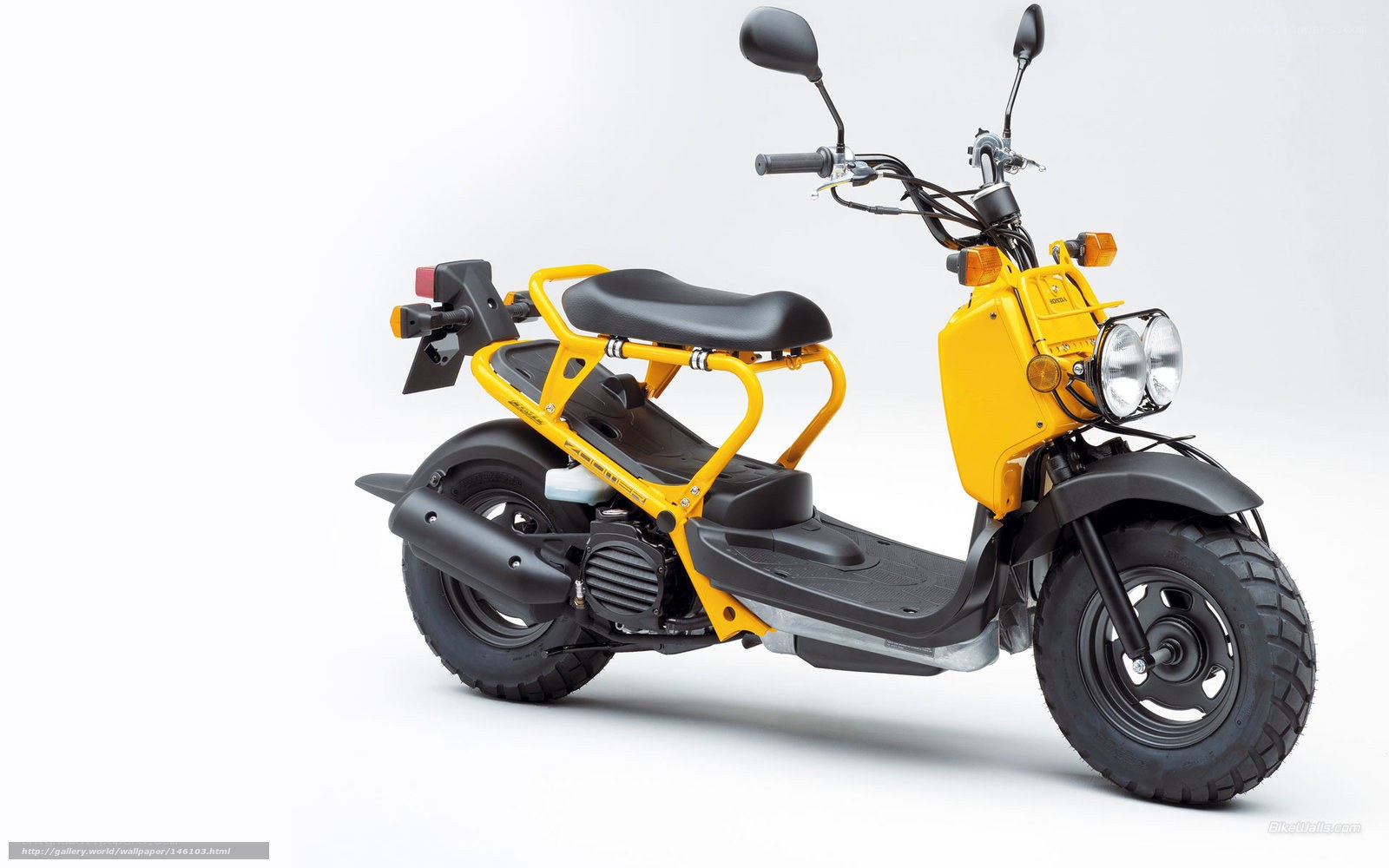 Yellow scooter with luggage rack