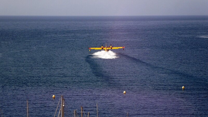 Yellow Seaplane on Water — Blue, Calm