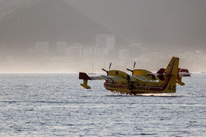 Yellow Seaplane on Water — Calm, Morning