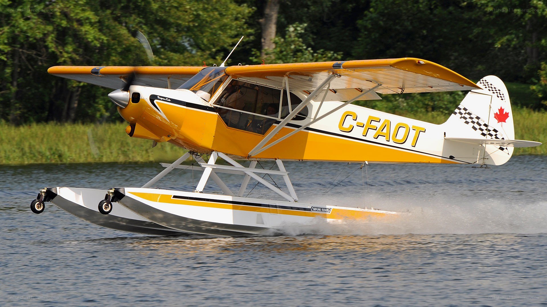 Yellow seaplane on water