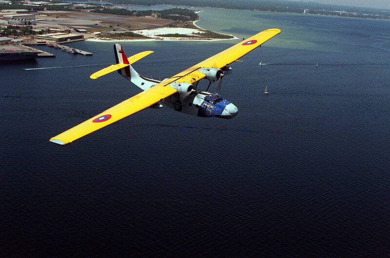 Yellow seaplane over water