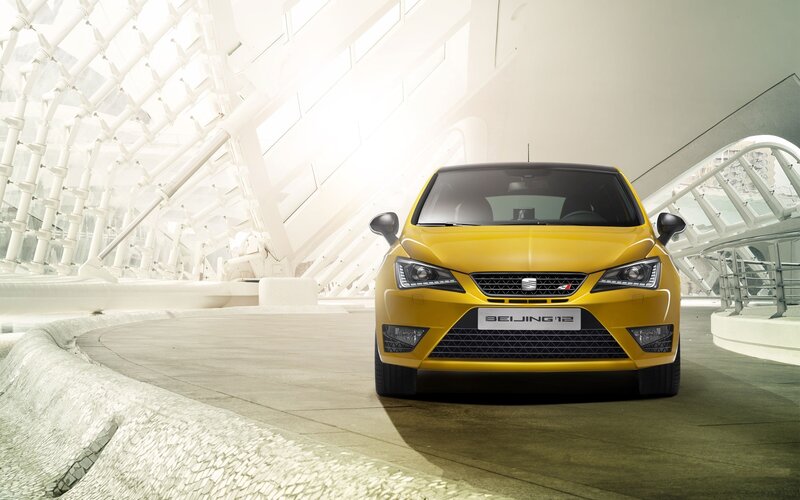 Yellow SEAT car in modern building