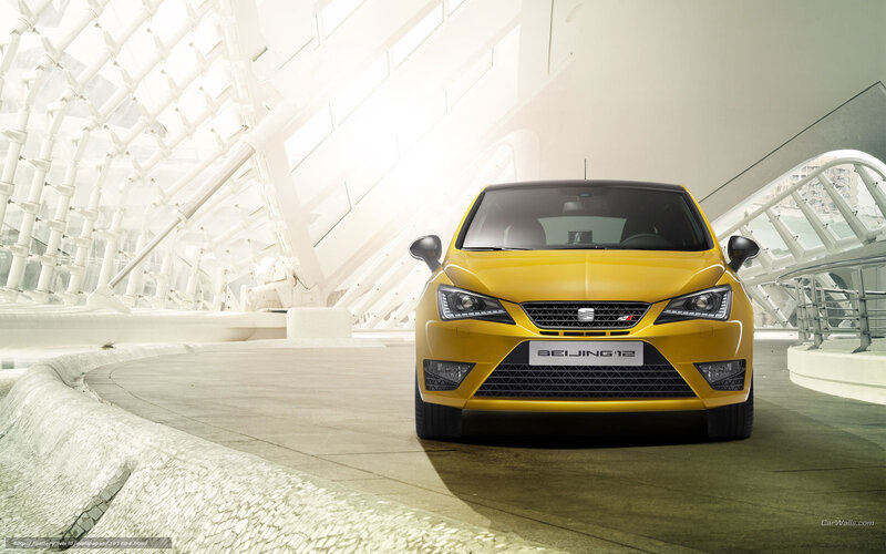 Yellow SEAT car in modern building