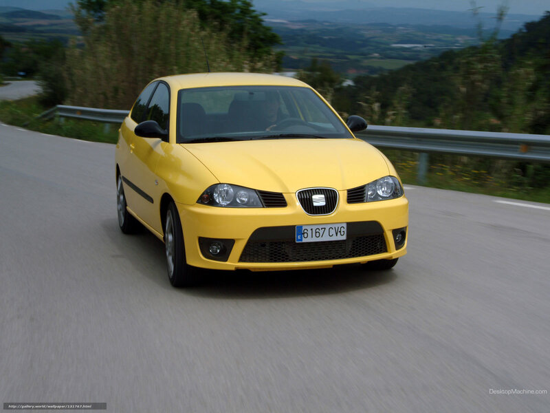 yellow seat car on winding road