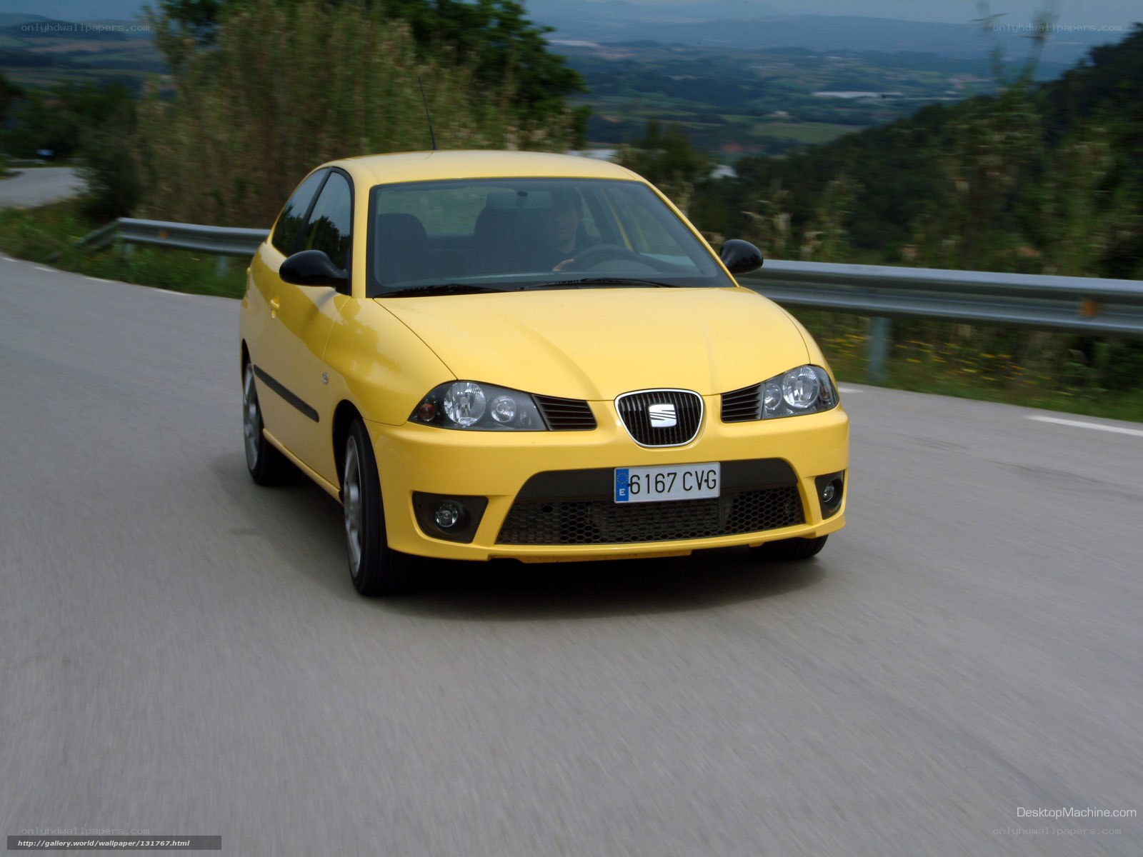 yellow seat car on winding road